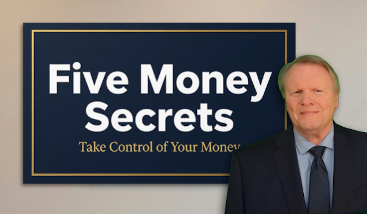 About Five Money Secrets Tom standing in front of the Five Money Secrets sign.